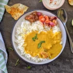 daal-tarka-with-rice-spoon-top-view-scaled